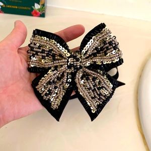 black bow brooch